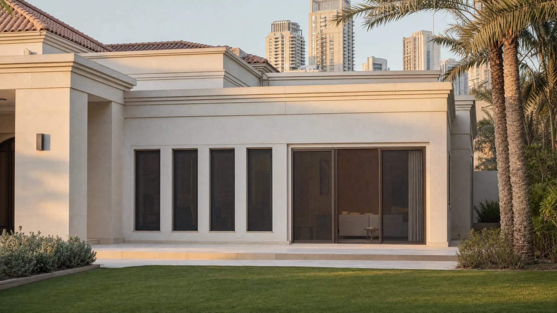 A Dubai villa: a row of windows and a terrace door with screens