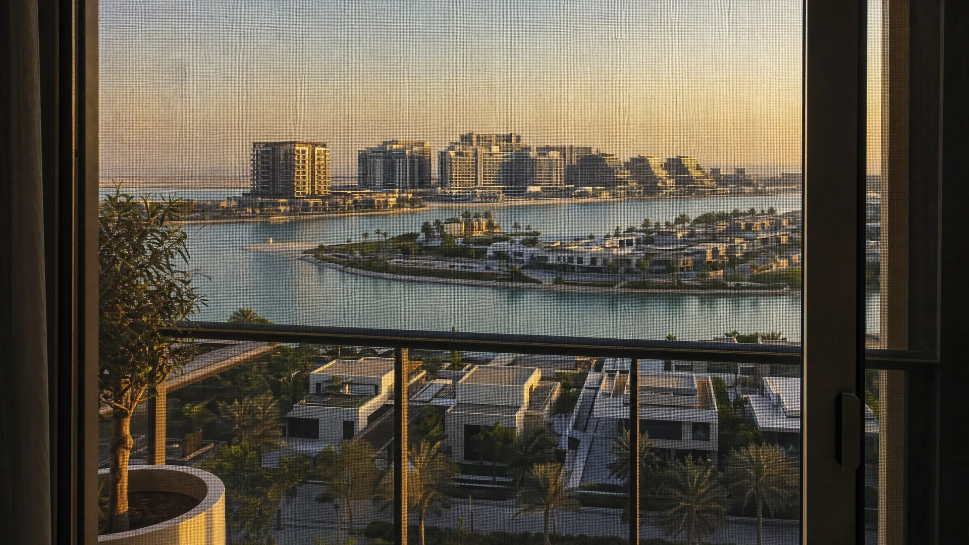 Typical Yas Island architecture with an insect screen on the window in front