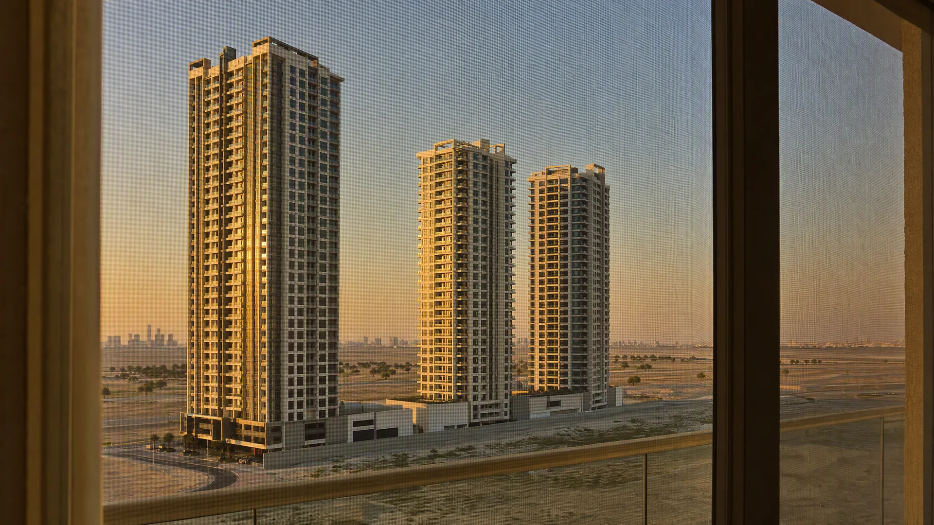 Typical Emirates City architecture with an insect screen on the window in front