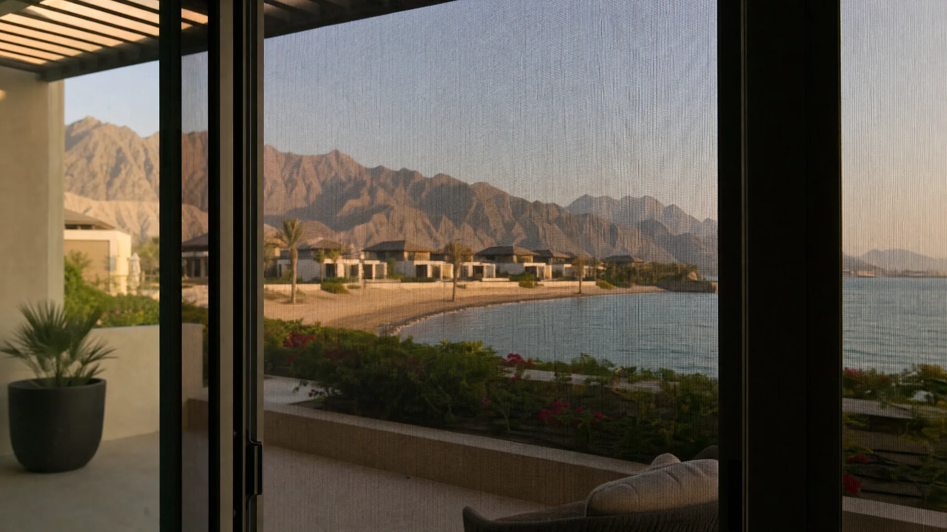 Typical Ras Al Khaimah architecture with an insect screen on the window in front