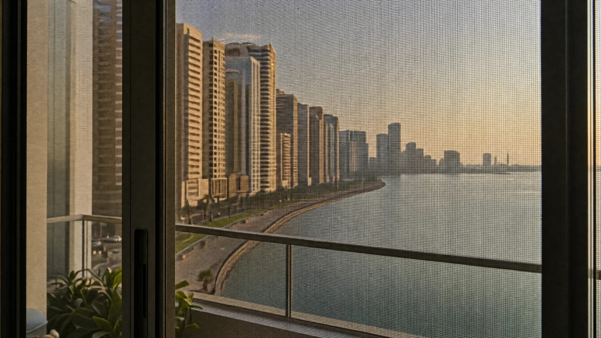 Typical Al Taawun architecture with an insect screen on the window in front